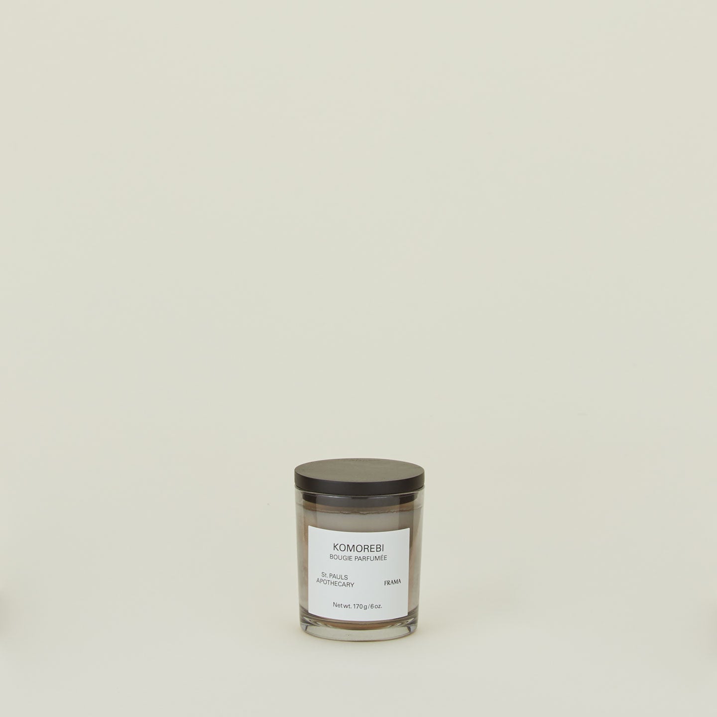 A wax candle with the scent Komorebi. 