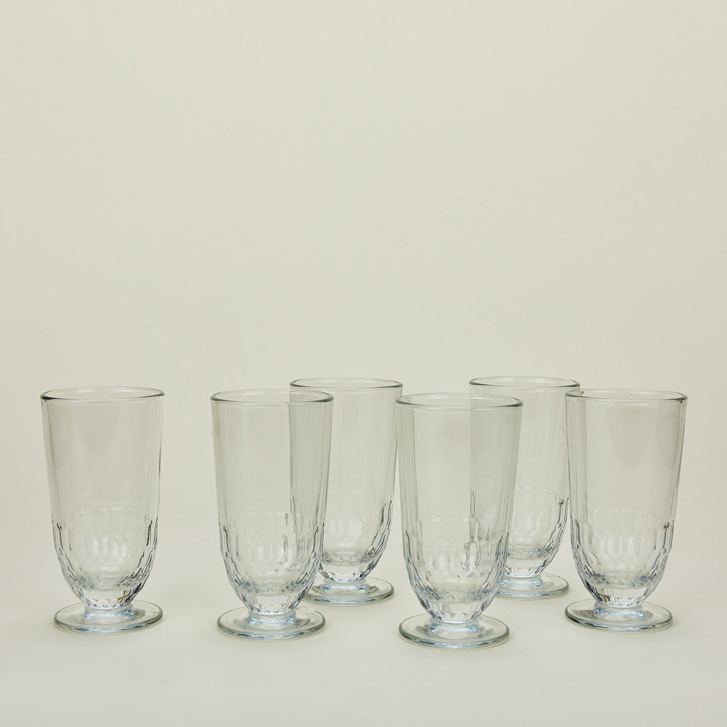 Six Artois Ice Tea glasses.