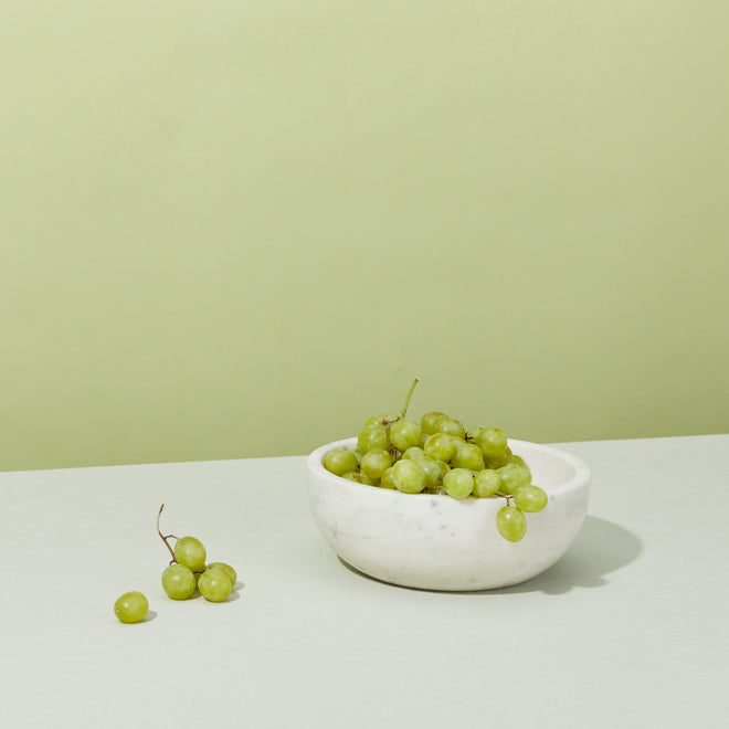 White marble bowl with grapes