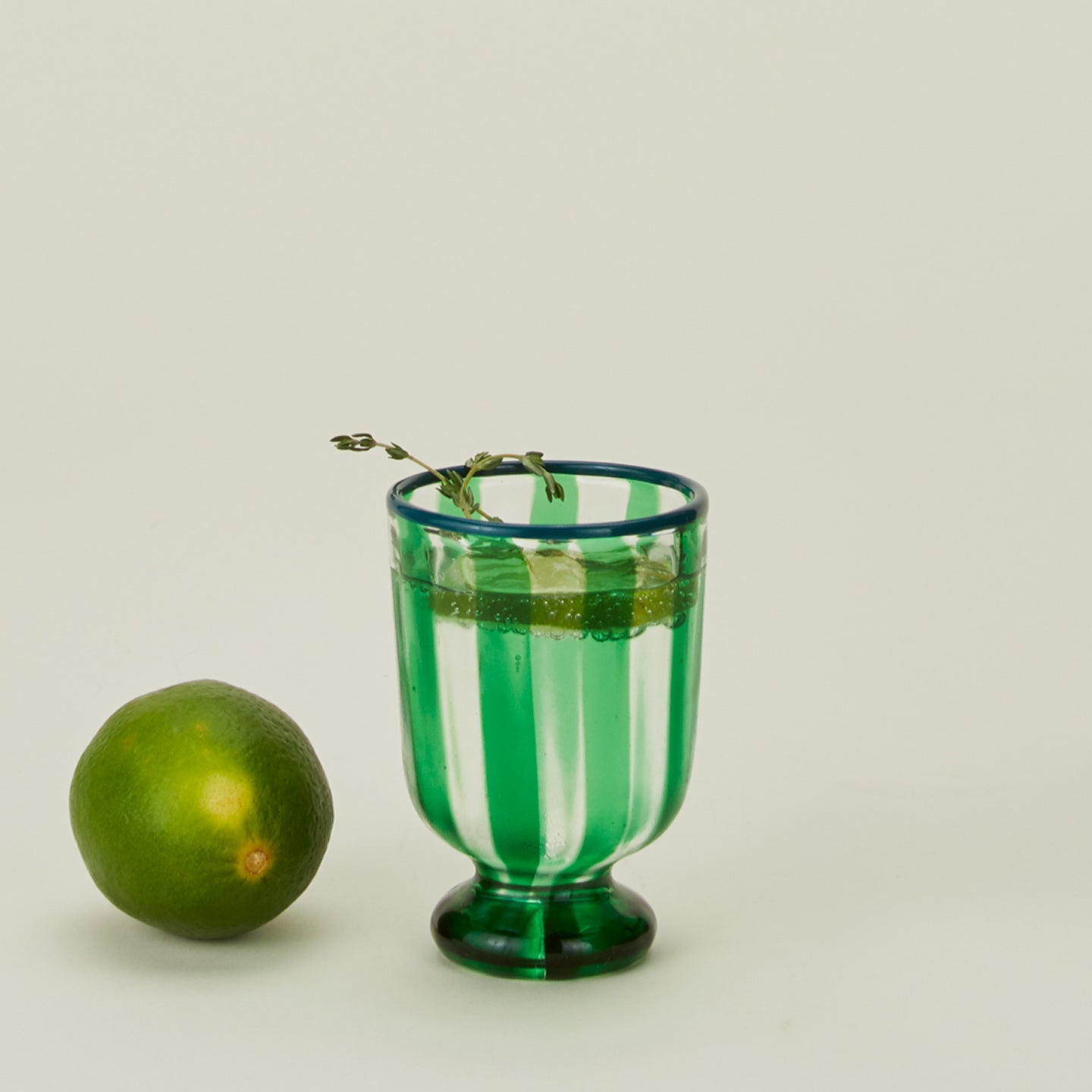 Striped wine glass in green with lime