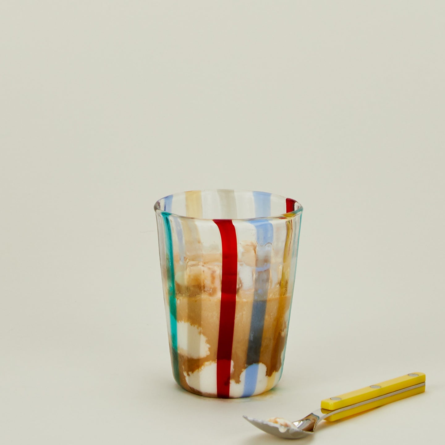 Multi striped tumbler with iced coffee