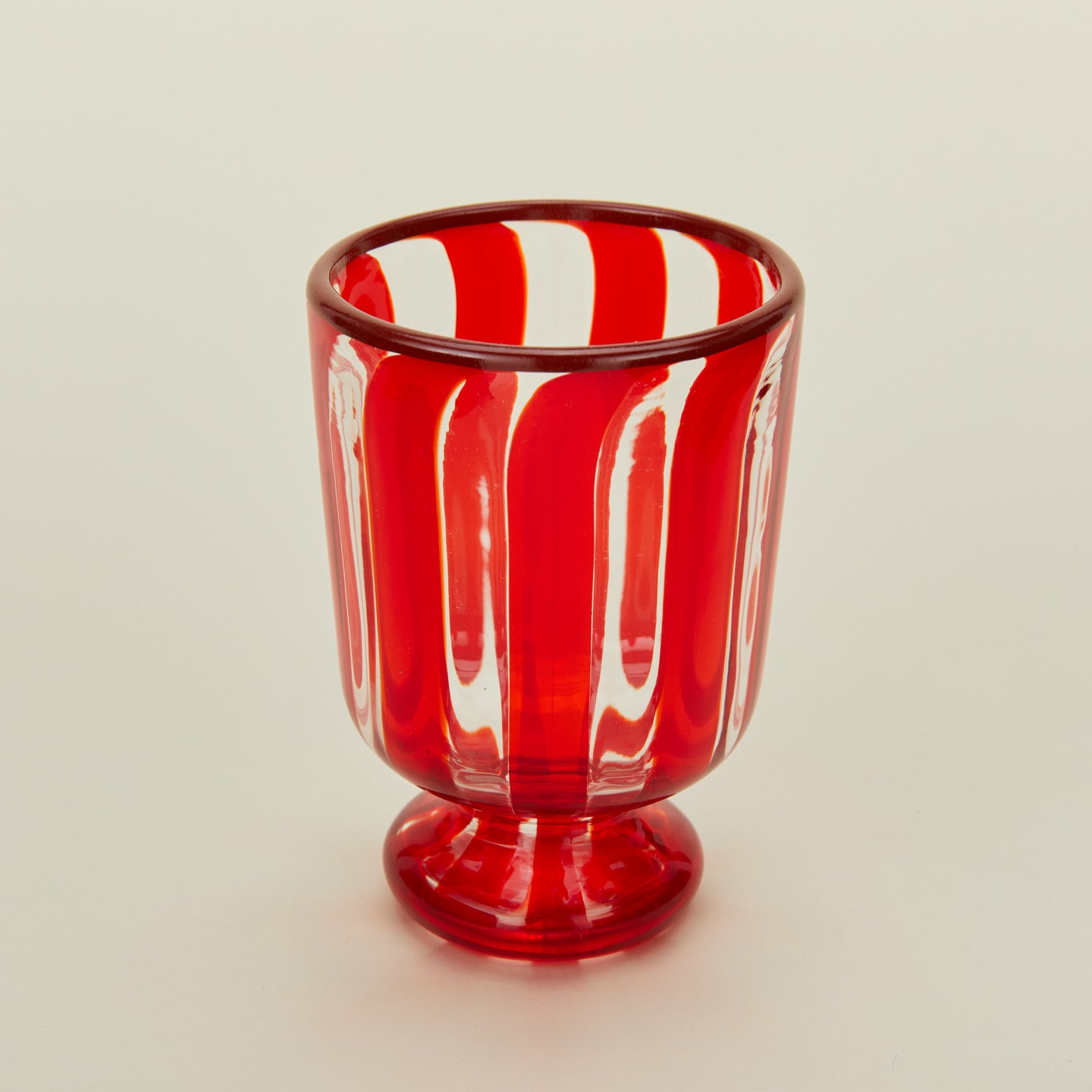 Close up view of red striped wine glass