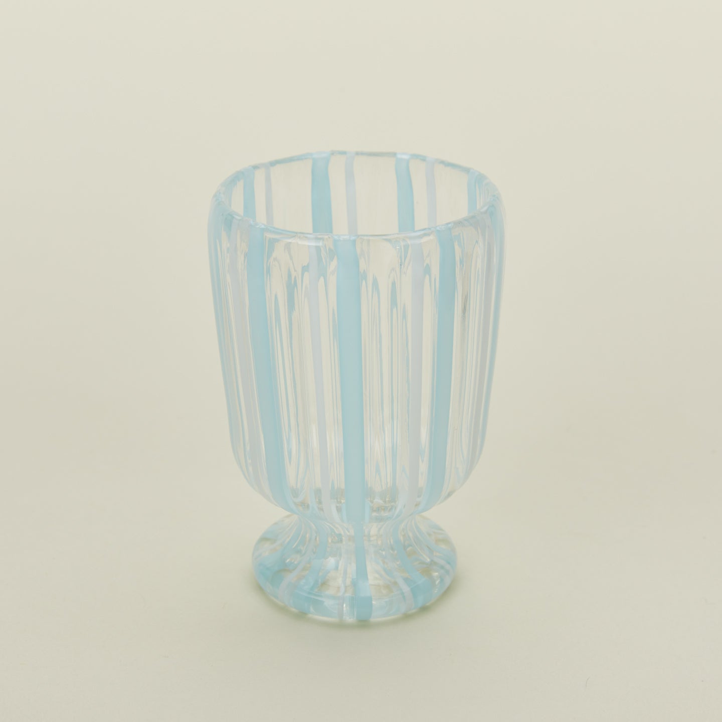 Close up view of white striped wine glass