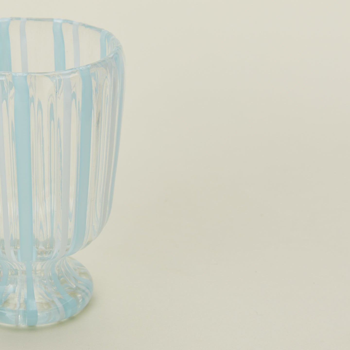 Close up view of white striped wine glass