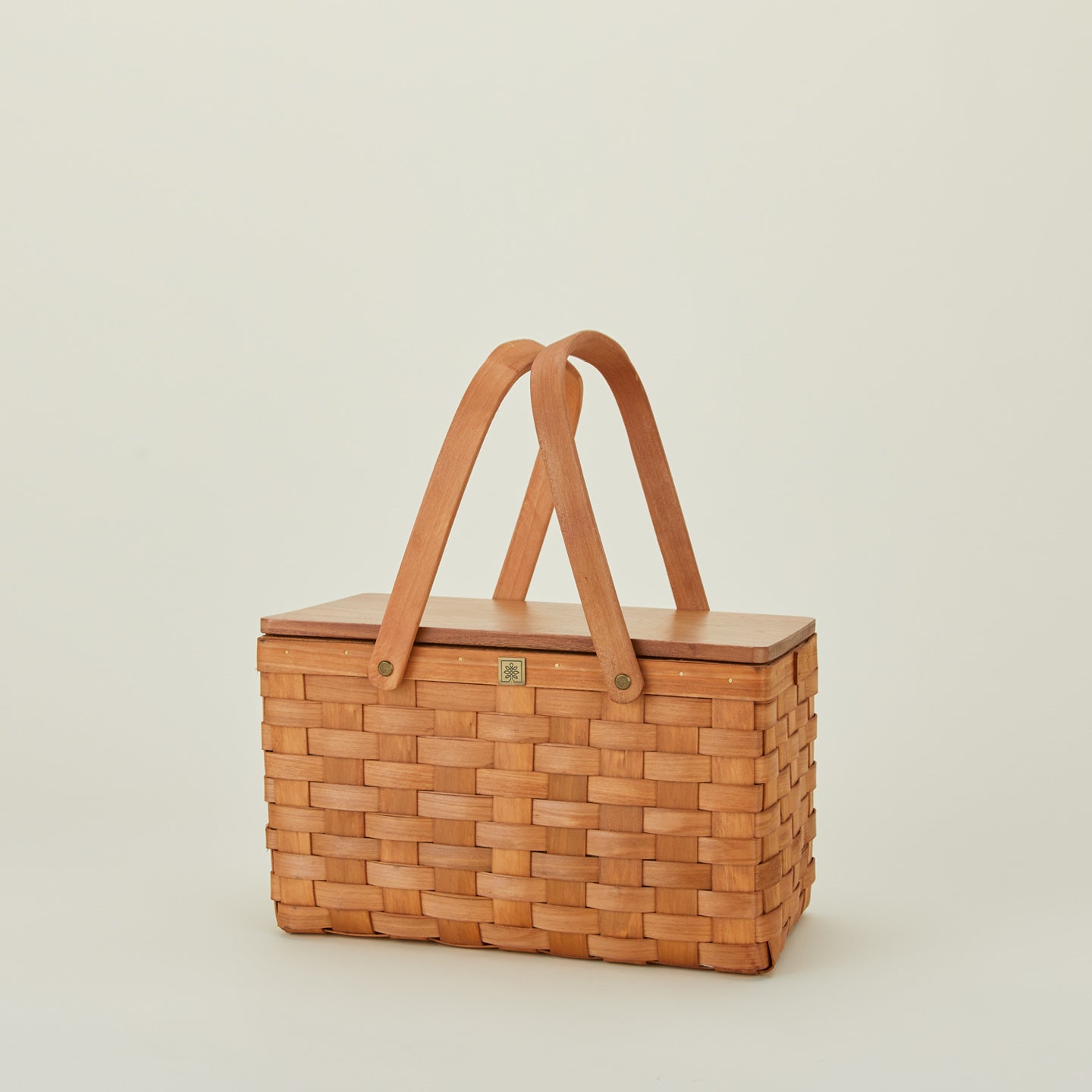 Picnic basket with lid closed and handles up
