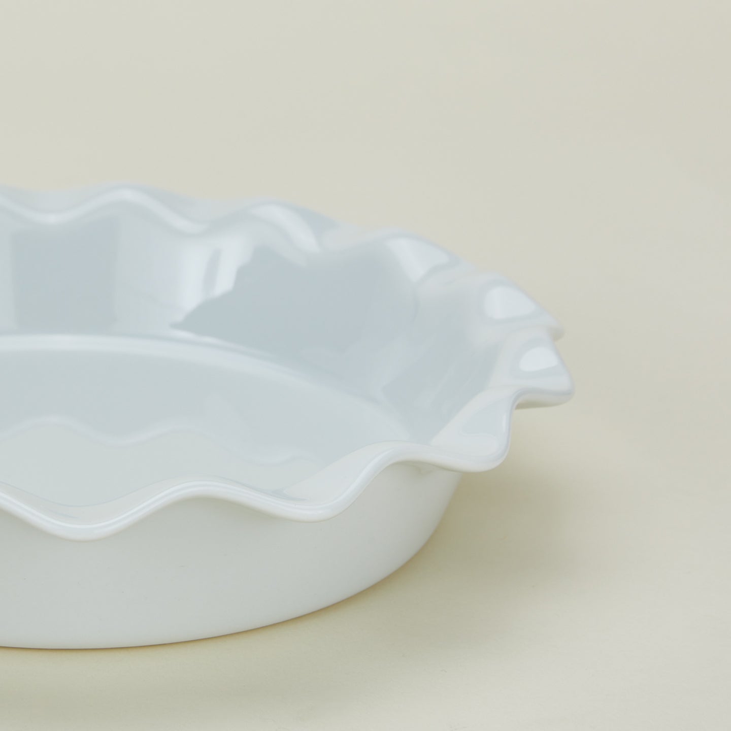 Detailed view of porcelain pie dish in white