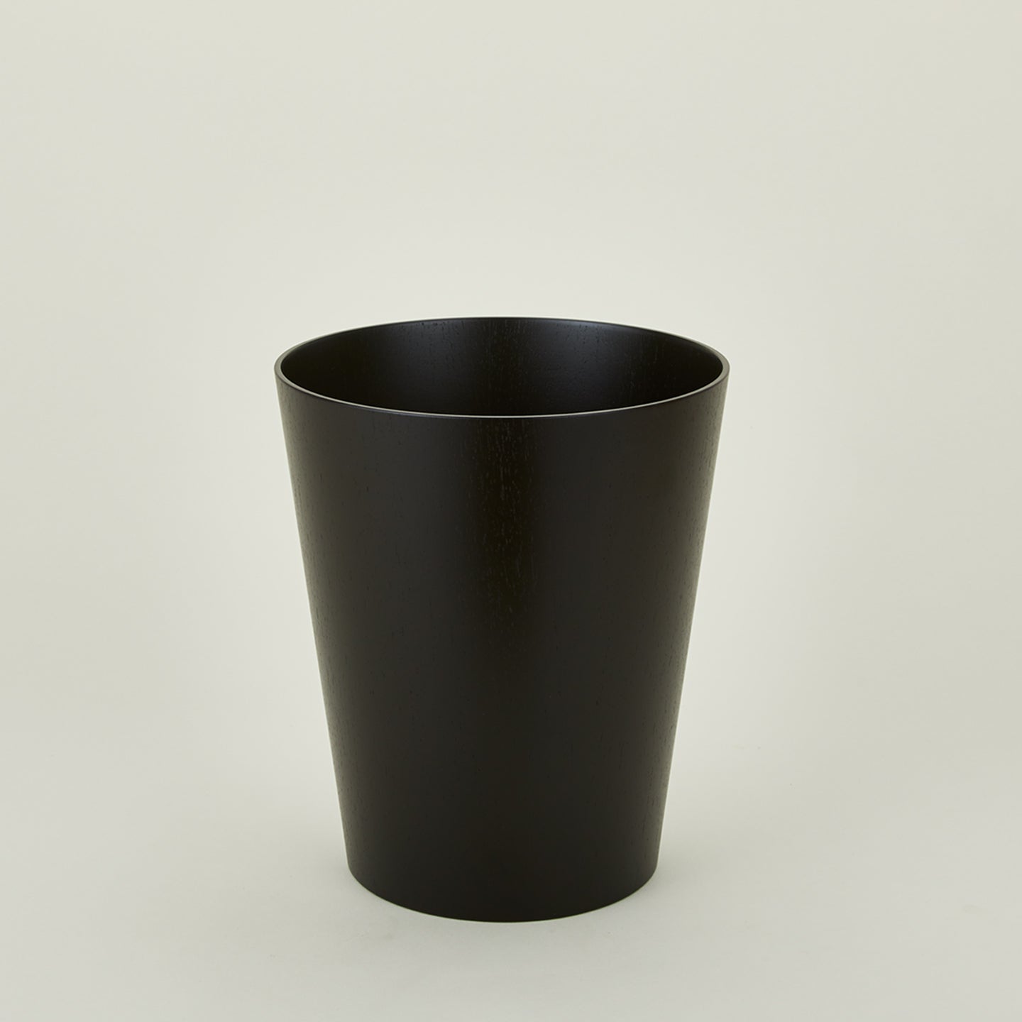 Wooden waste basket in dark