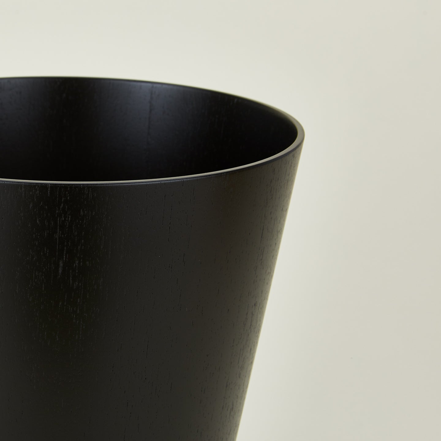 Close up view of wooden waste basket in dark