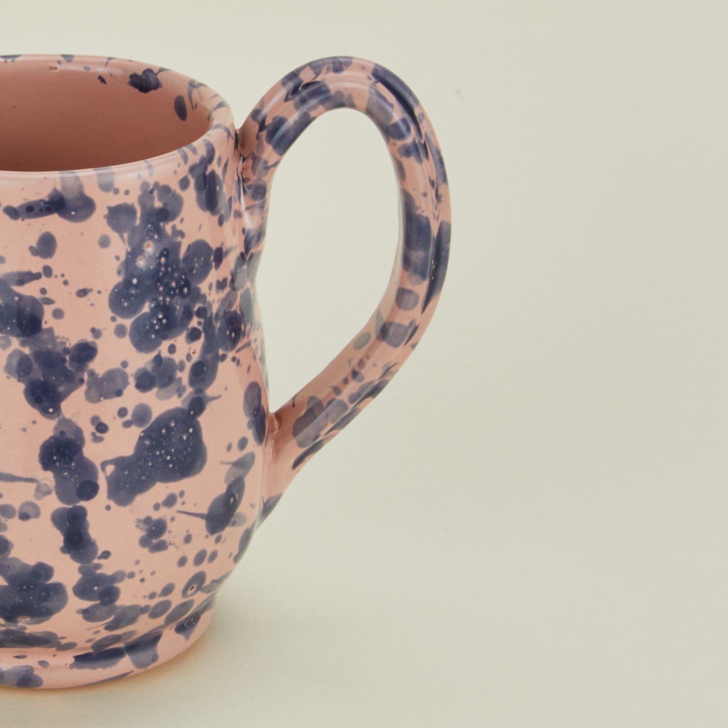 Close up view of Splatter mug in pink and blue