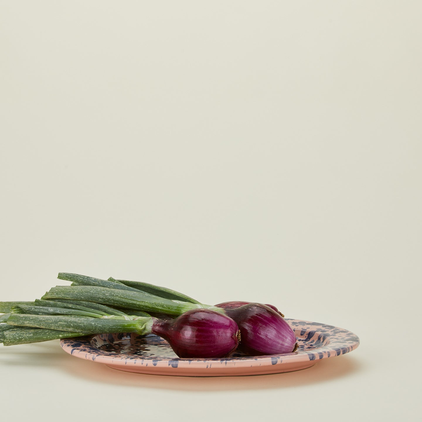 Splatter pink and blue oval platter with onions