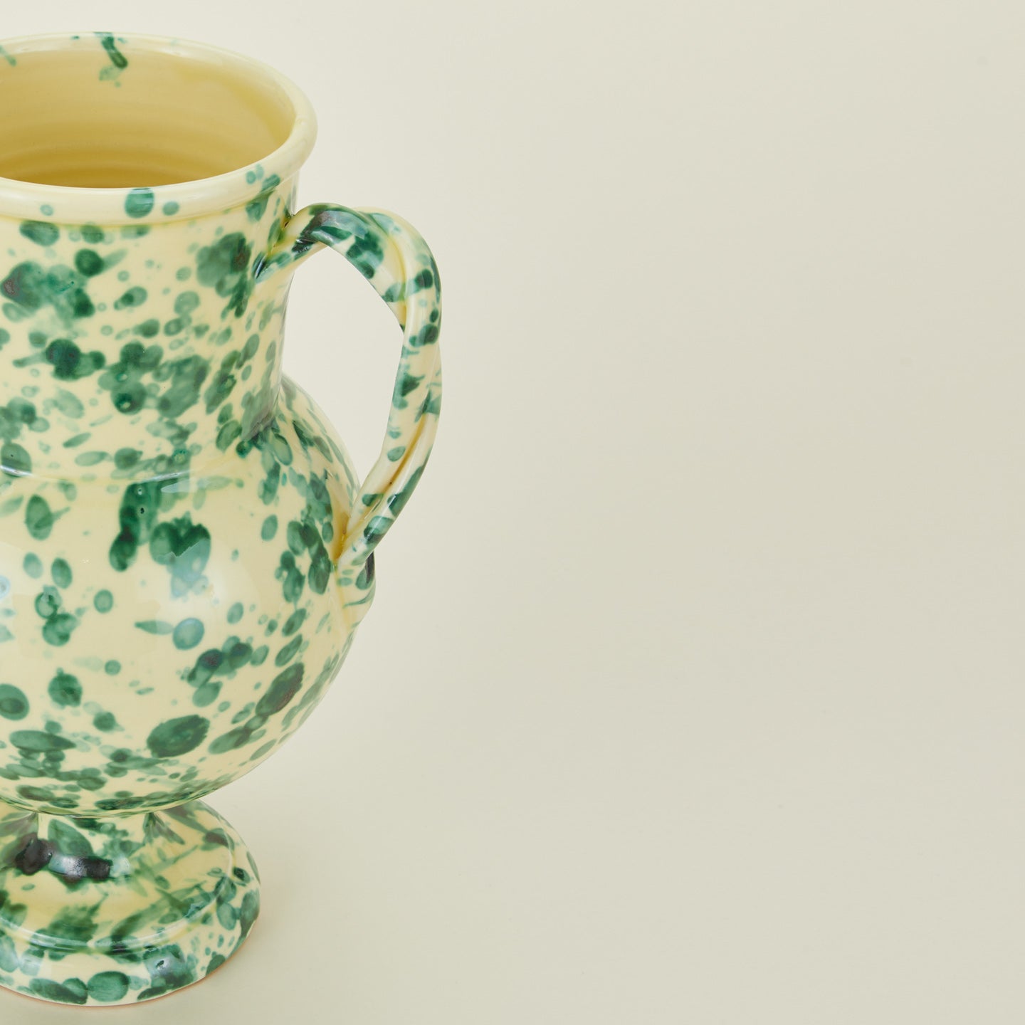 Close up view of yellow and green verona vase