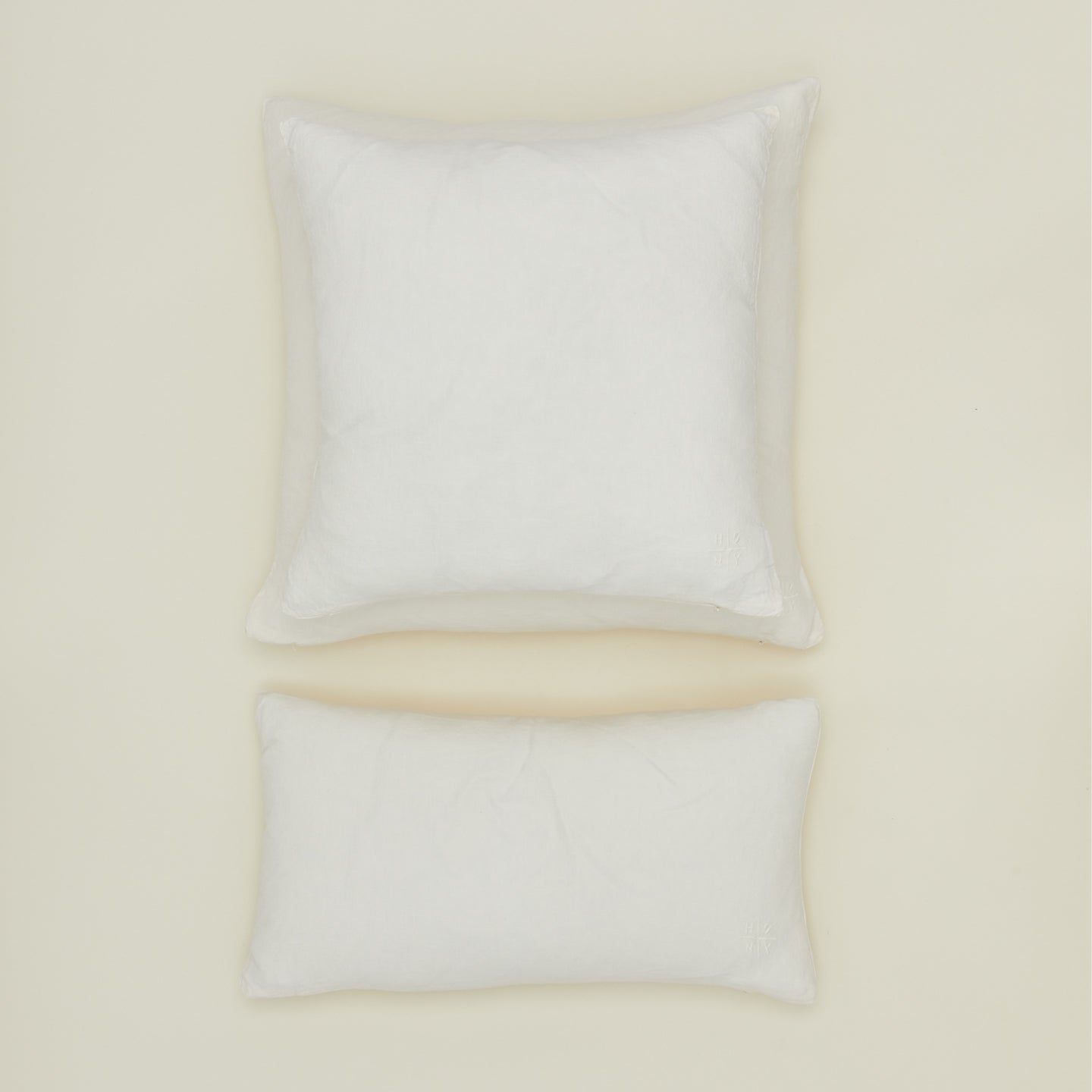 Simple linen pillow in ivory