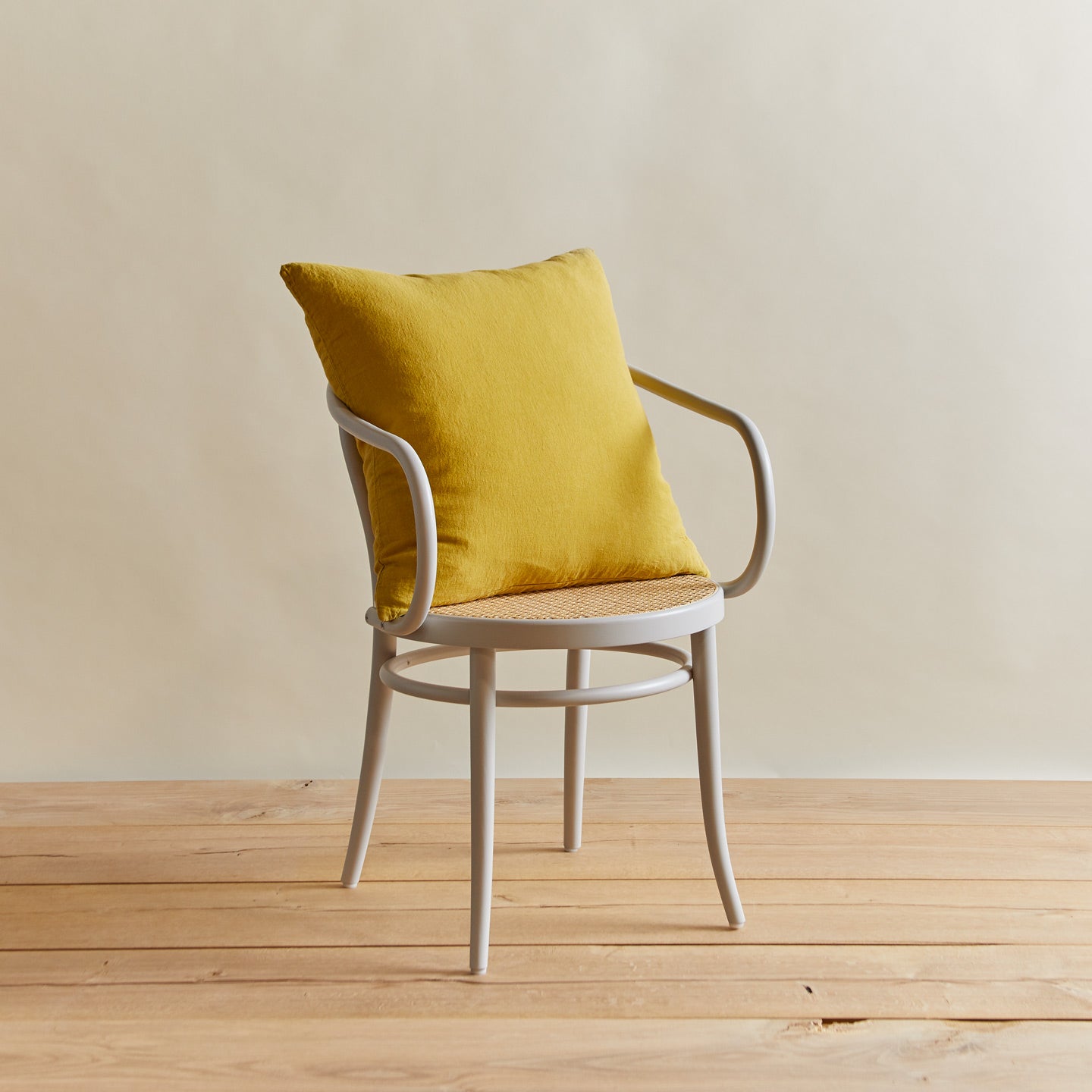Simple linen pillow in mustard