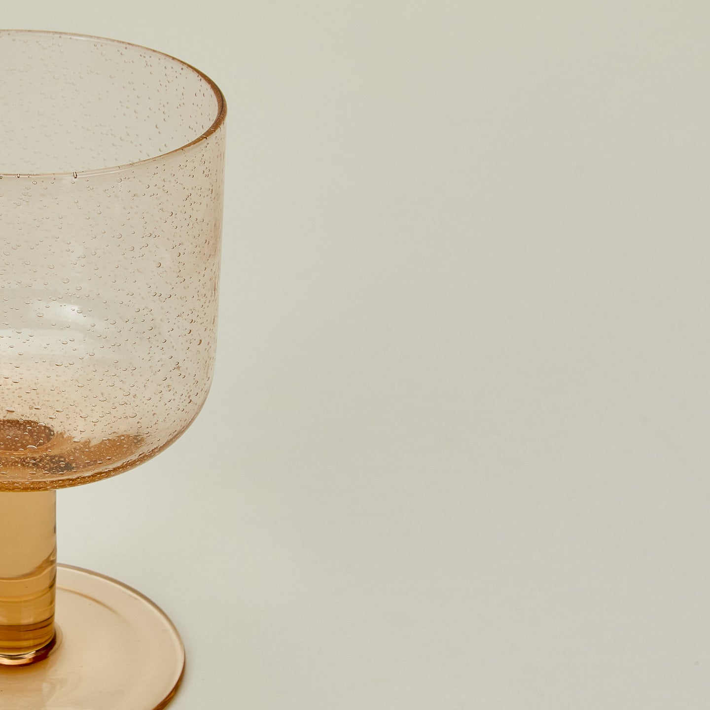 Detailed view of Simple seeded glassware in Peach.