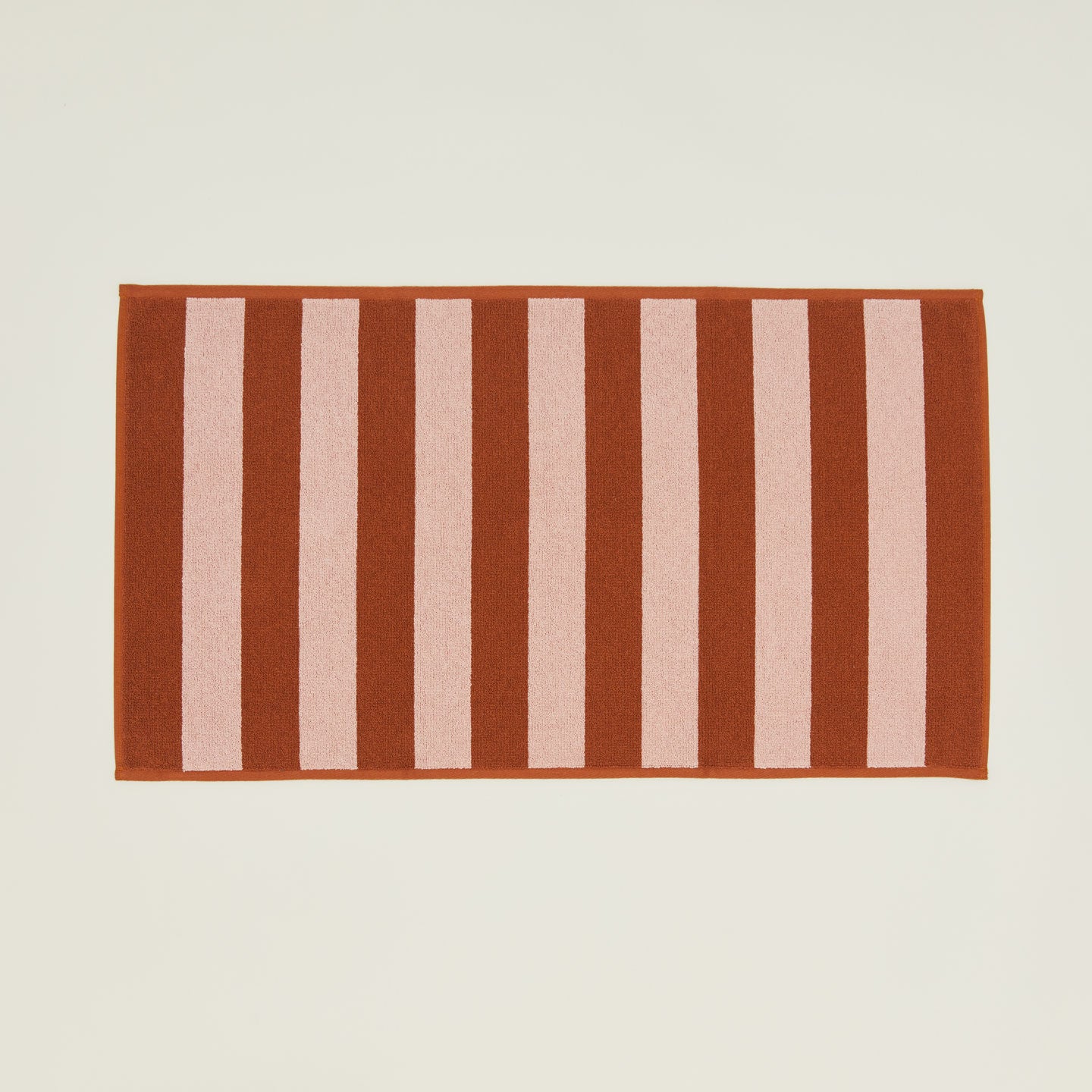Simple Striped Terry Bath Mat in blush and terracotta.