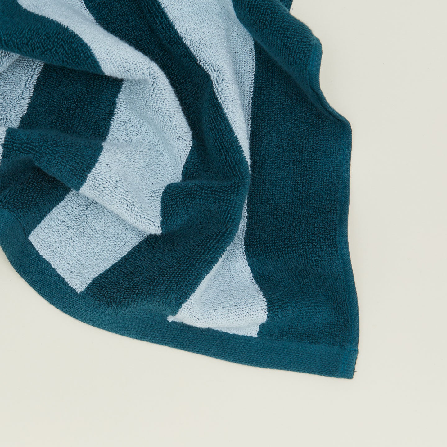 Close up of Simple Striped Terry Bath Mat in sky and peacock.