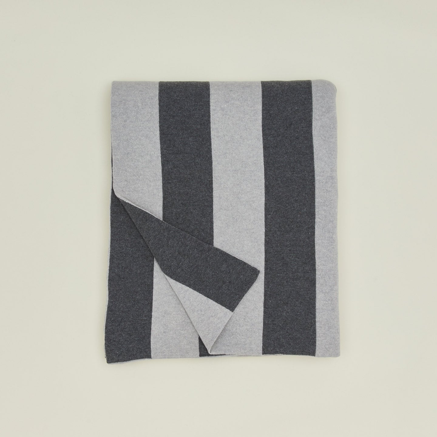 Folded simple striped throw in light and dark grey