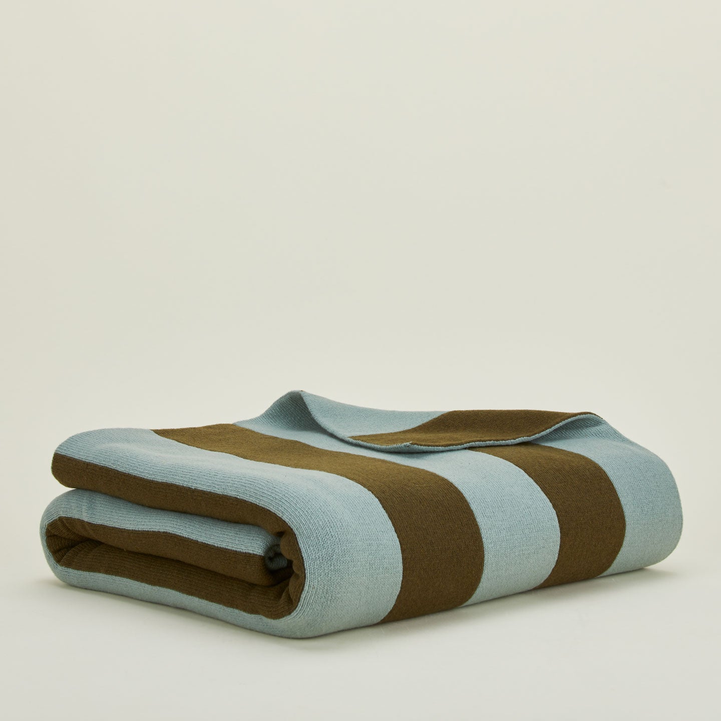 Folded simple striped throw in olive and sage