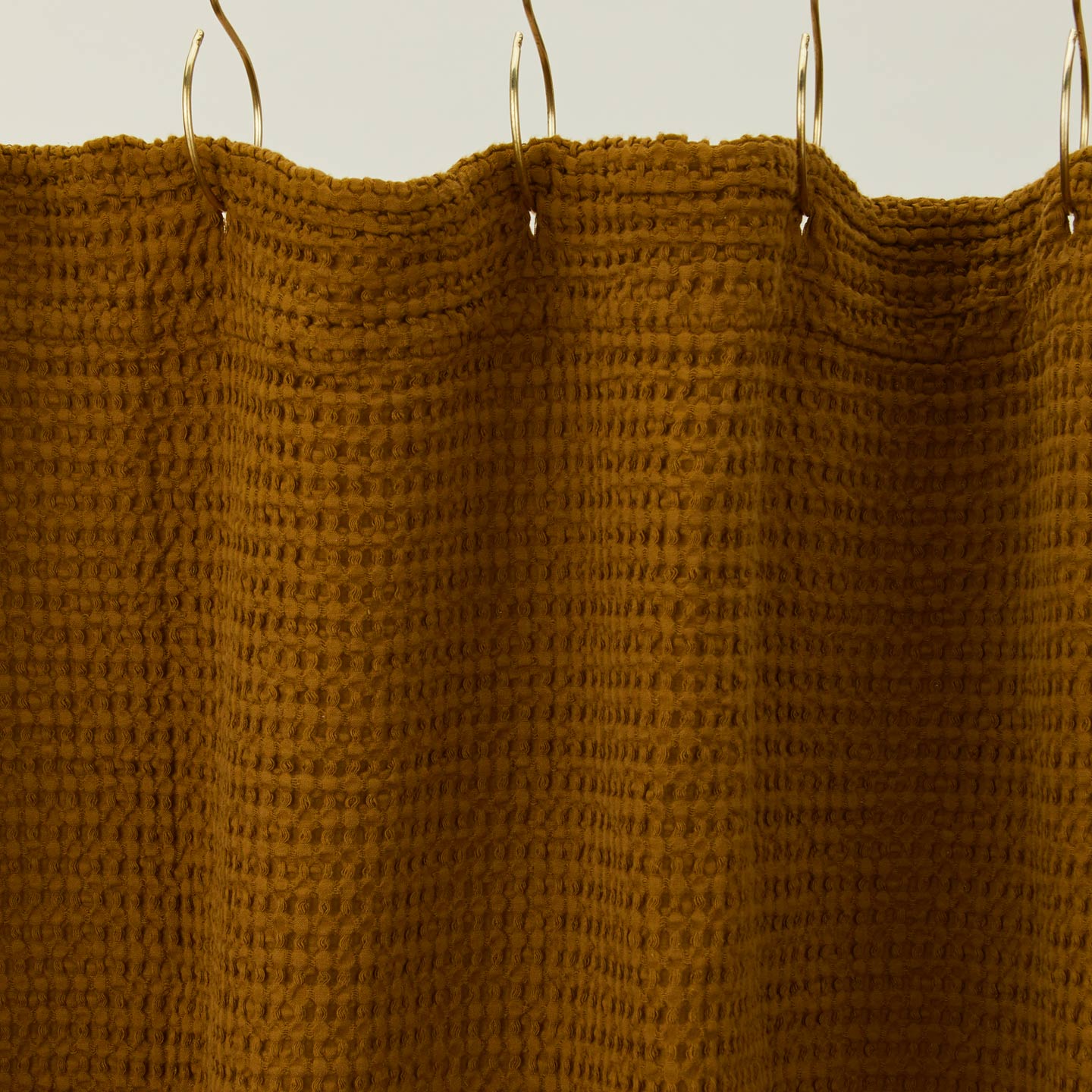 Simple waffle shower curtain in bronze