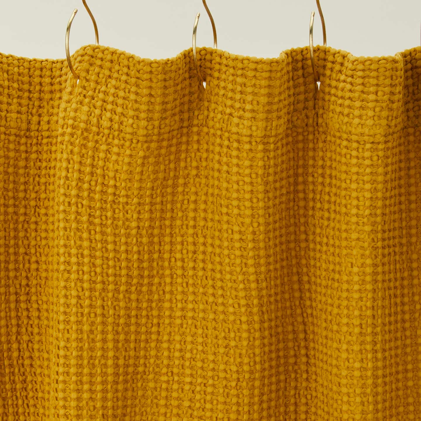 Simple waffle shower curtain in mustard