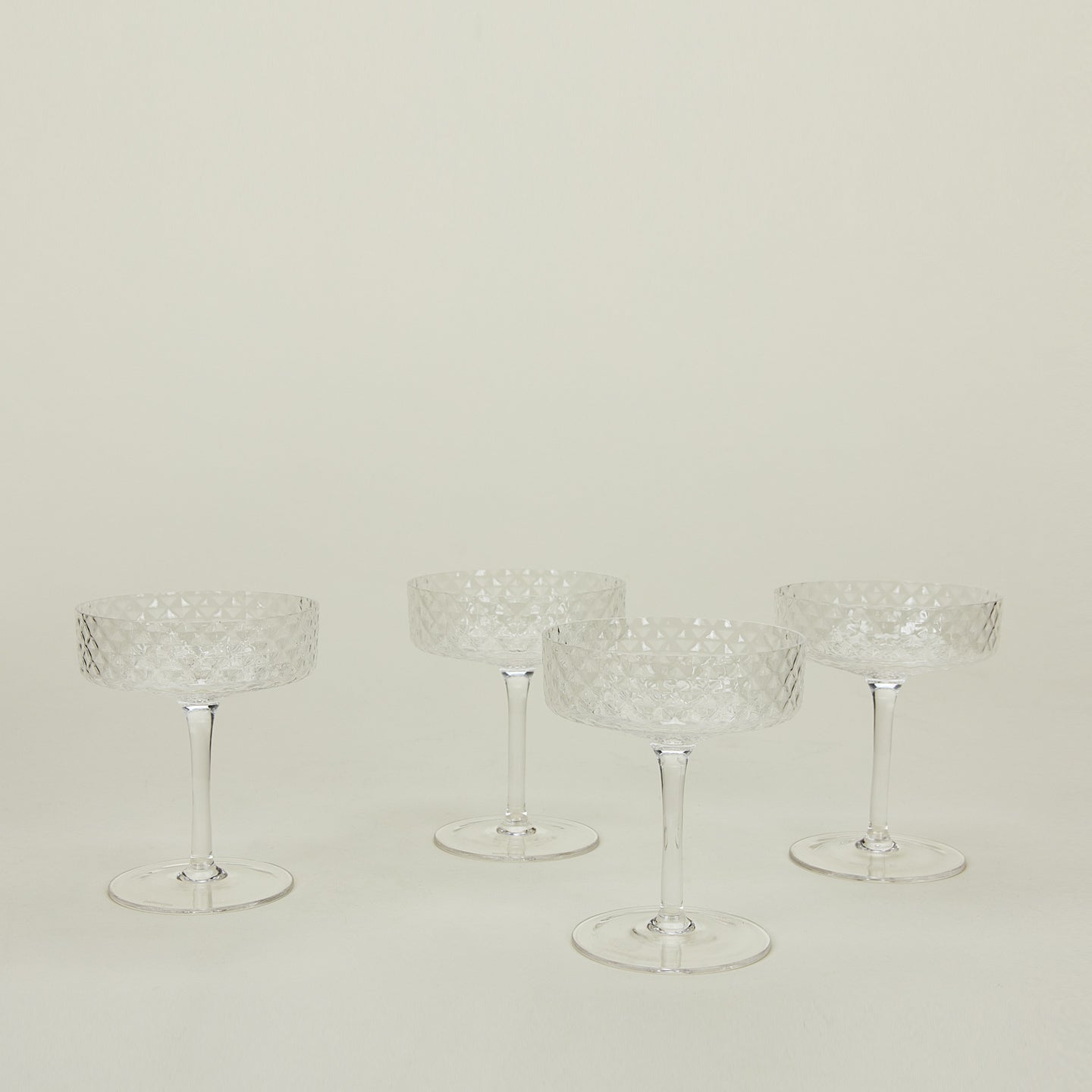 Four Veneziano coupe glasses.