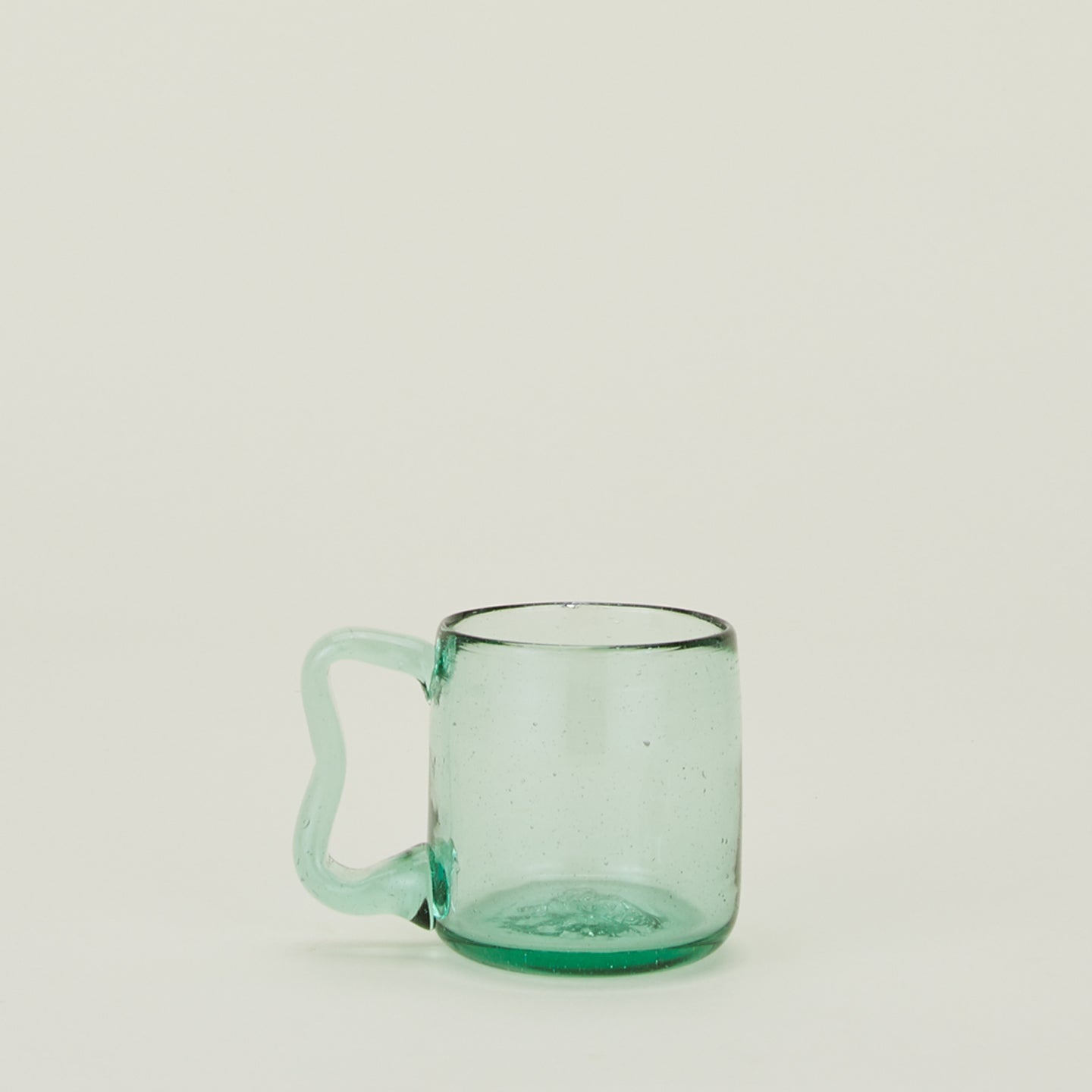 Green glass Wavy Recycled Small Mug with wavy handle.
