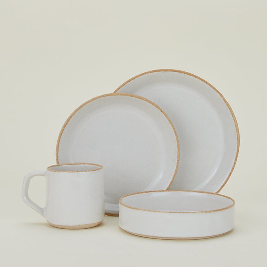 Group of Minimal Dinnerware including bowl, salad plate, dinner plate and mug.