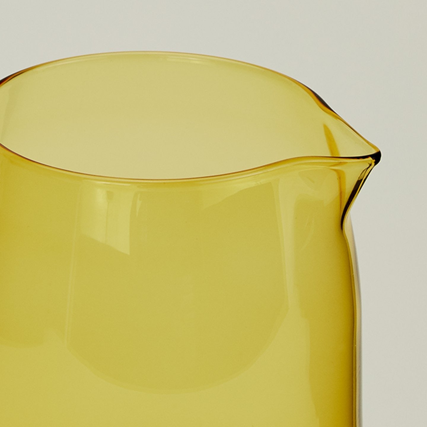 Close up of the rim of the Essential Glassware Pitcher in Amber.