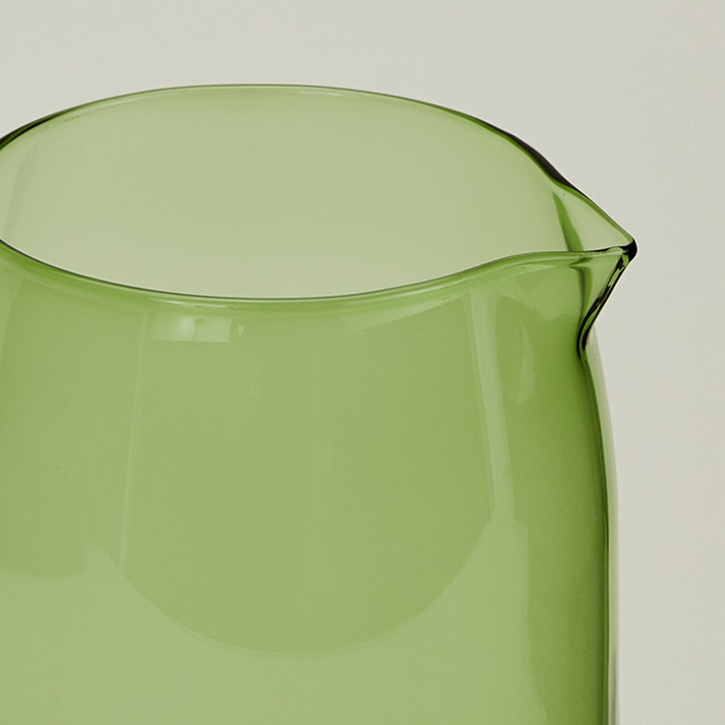 Close up of the rim of the Essential Glassware Pitcher in Green.