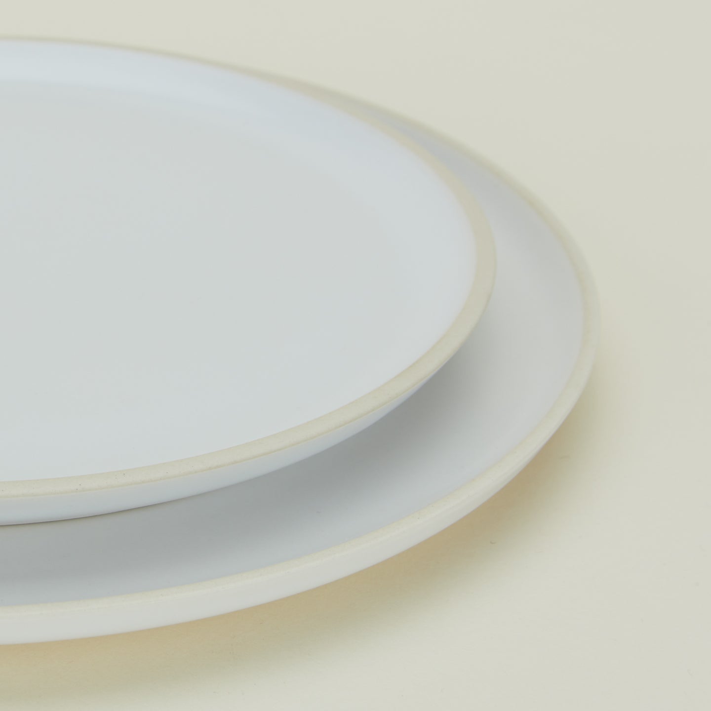 Close up of Modernist Salad Plate and Modernist Dinner Plate stacked.