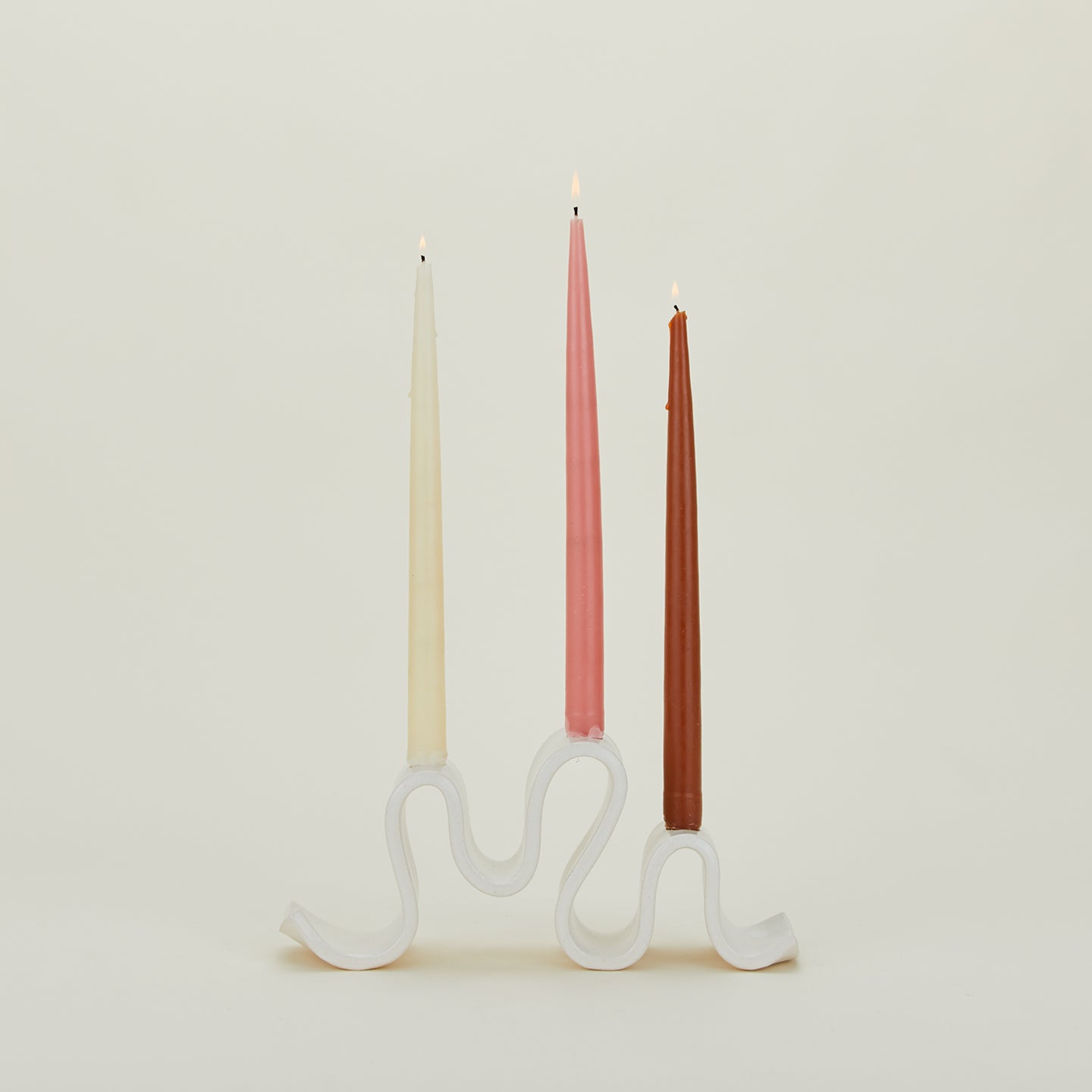 Stoneware Wyat Candelabra with taper candles.