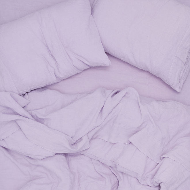 overhead of lilac colored linen bedding