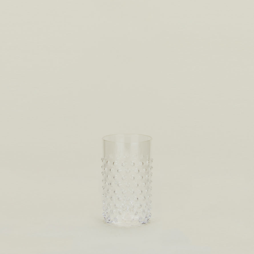 Textured clear glass tumbler.