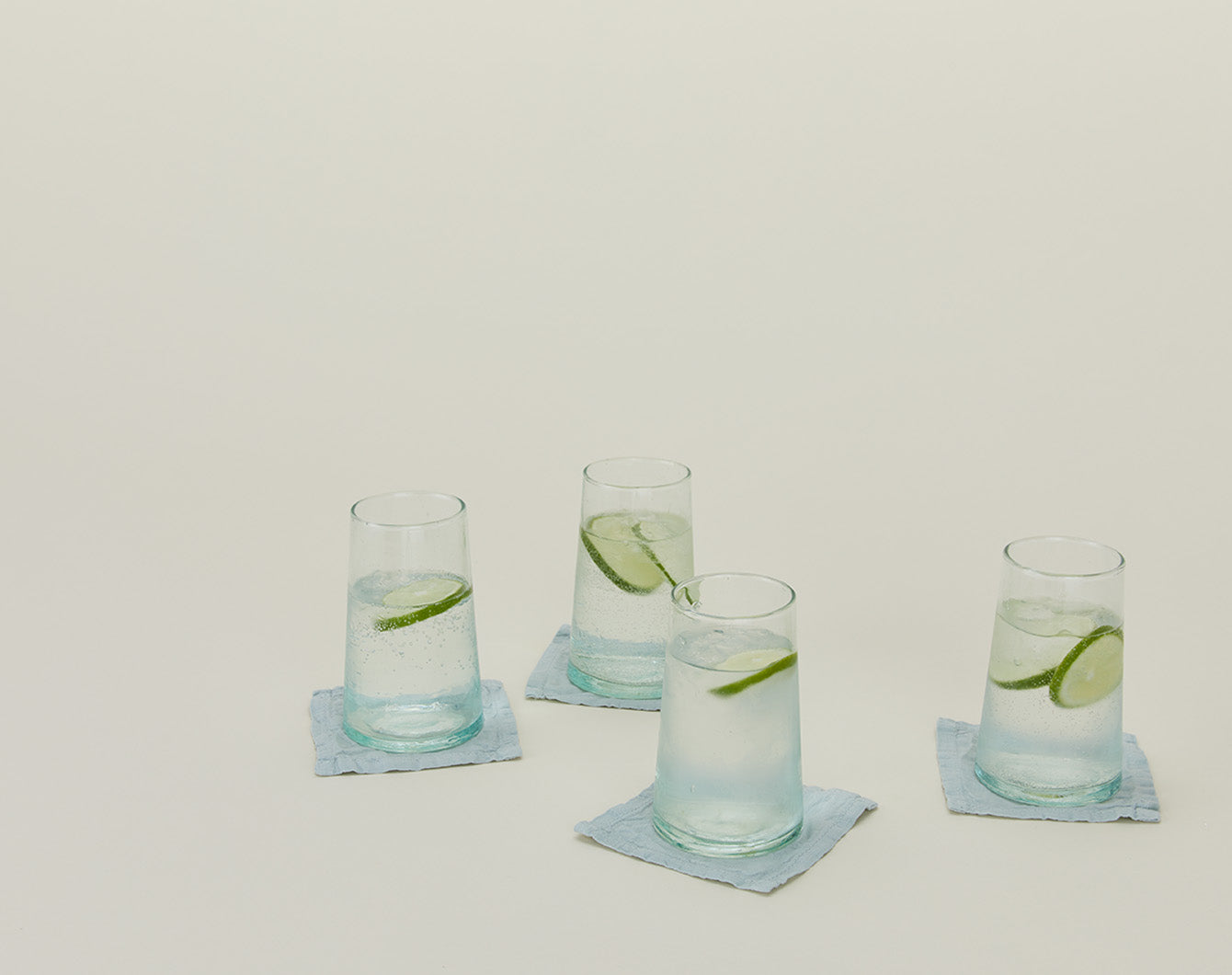 Recycled glassware and blue cocktail coasters