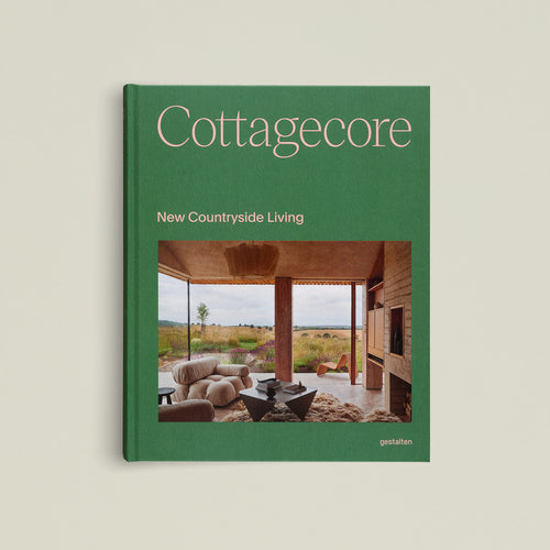 Book titled 'Cottagecore: New Countryside Living' with a green cover on a beige background