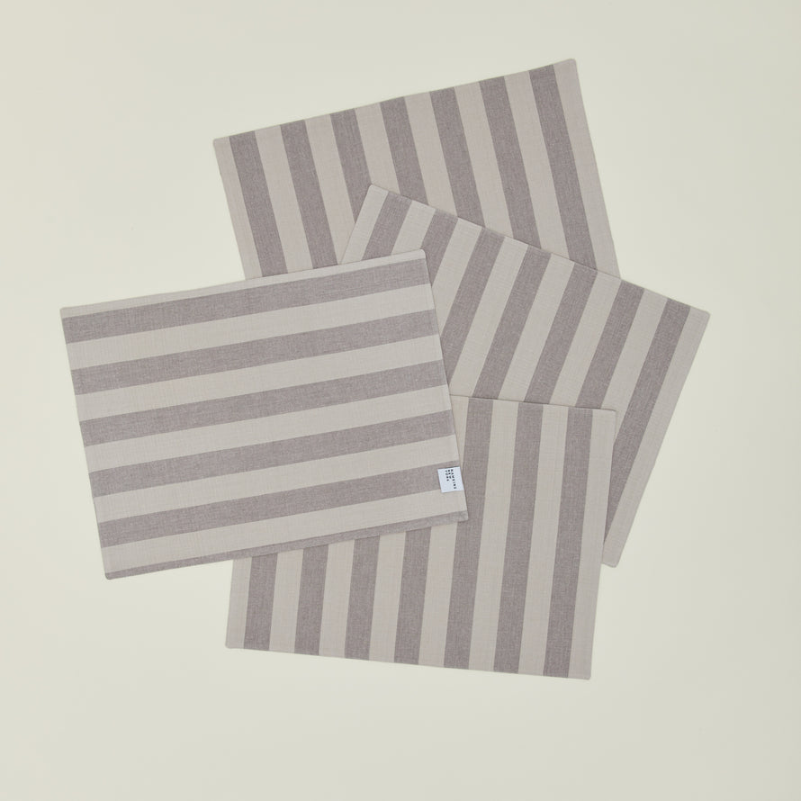 Set of four Essential Striped Placemats in Light Grey and Dark Grey.