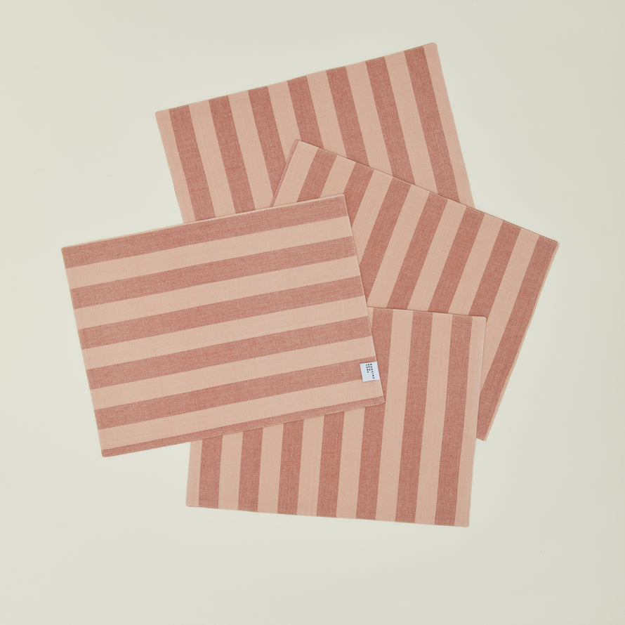Set of four Essential Striped Placemats in Blush and Terracotta.