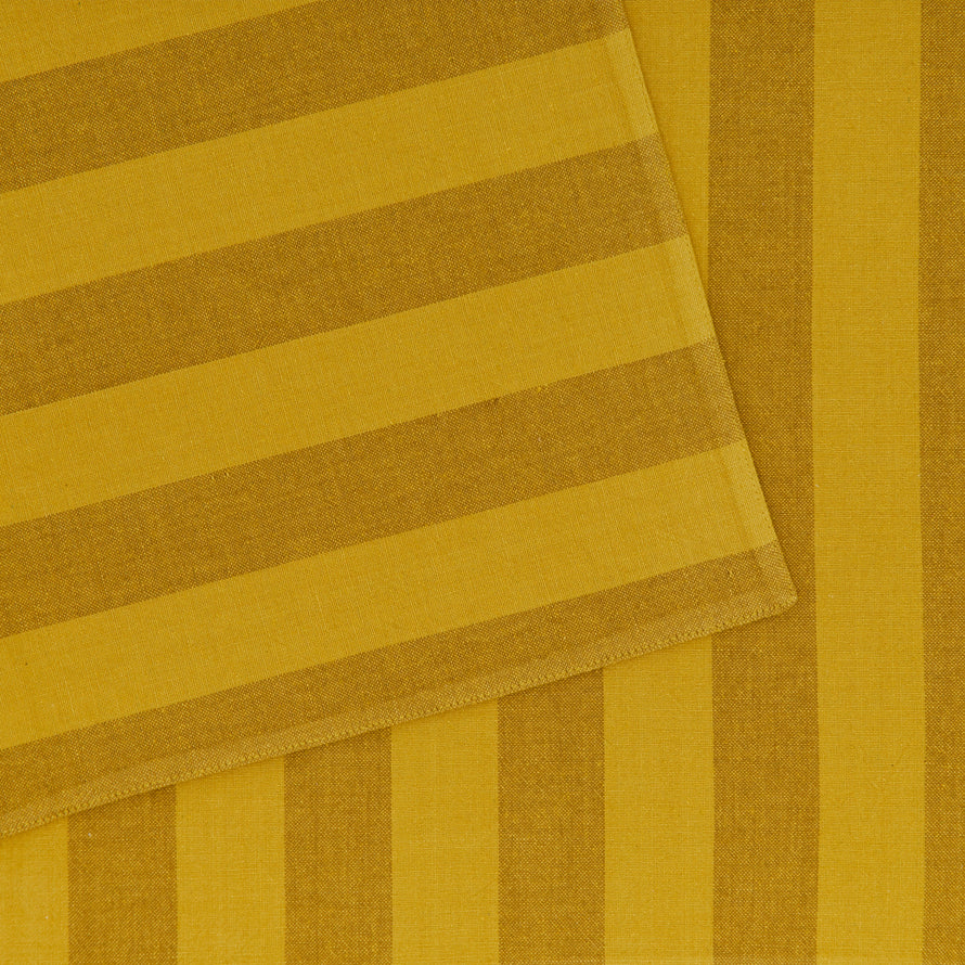 Close up of Essential Striped Placemat in Mustard and Bronze.