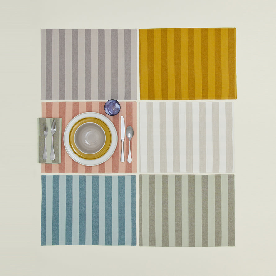 Group of Essential Striped Placemats in various colors.