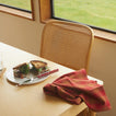 Tablescape with Simple Porcelain Salad Plate with sandwich and knife and Essential Gingham Napkin.