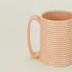 Close up of a Tall Ribbed Mug in Blush.