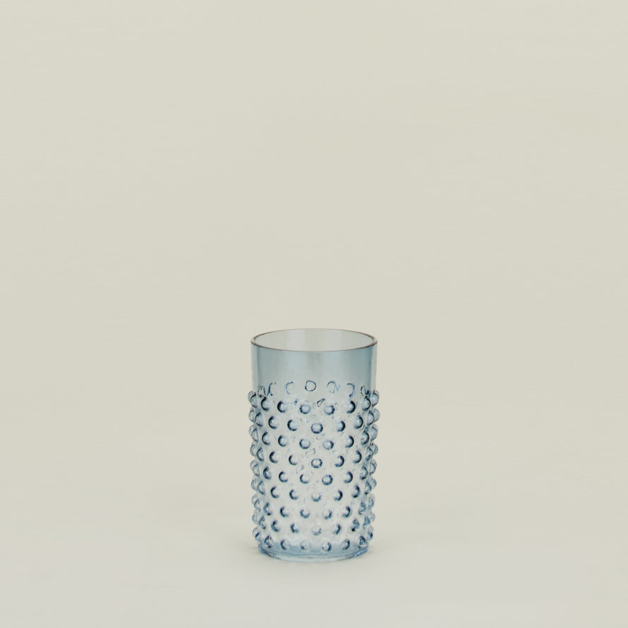 Textured blue glass tumbler.
