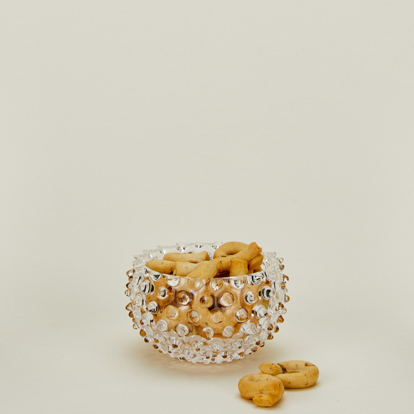 Glass hobnail clear tapas bowl with crackers.