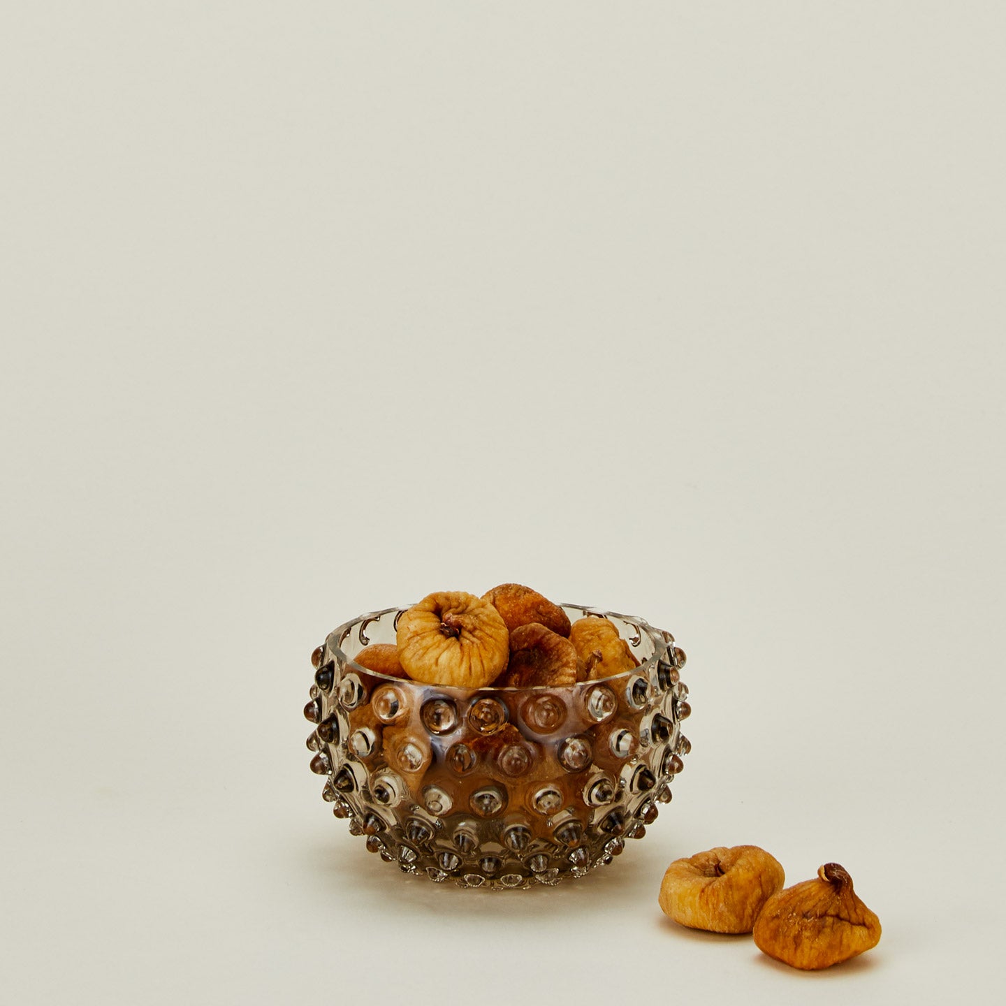 Glass hobnail grey tapas bowl with figs.
