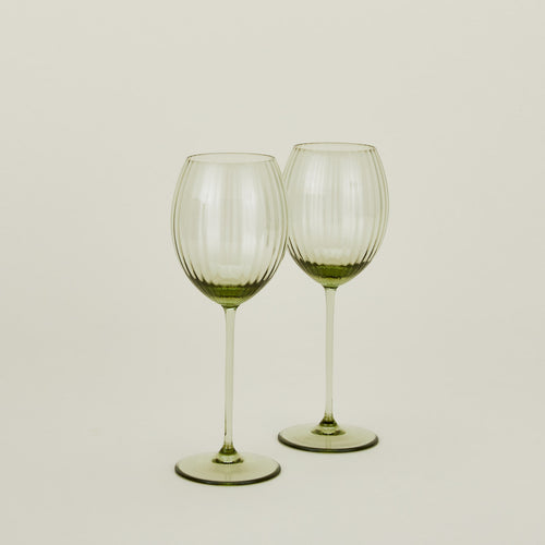 Set of two ribbed olive wine glasses.