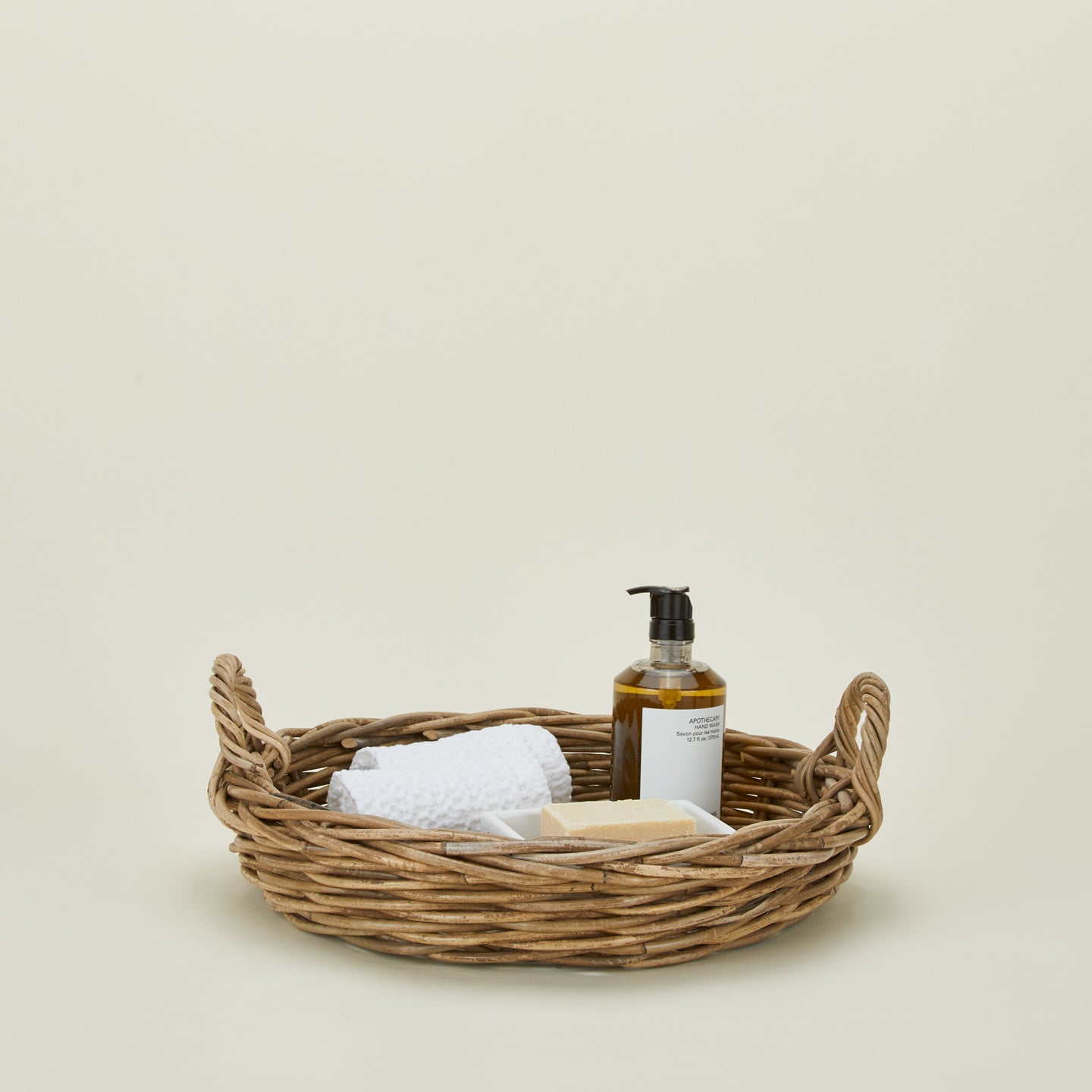 Medium Rattan tray with soap, washcloths, and soap pump