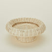 Detailed view of natural rattan pedestal bowl