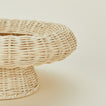 Close up view of natural rattan pedestal bowl