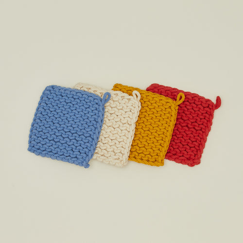 Crocheted pot holders in primary colors