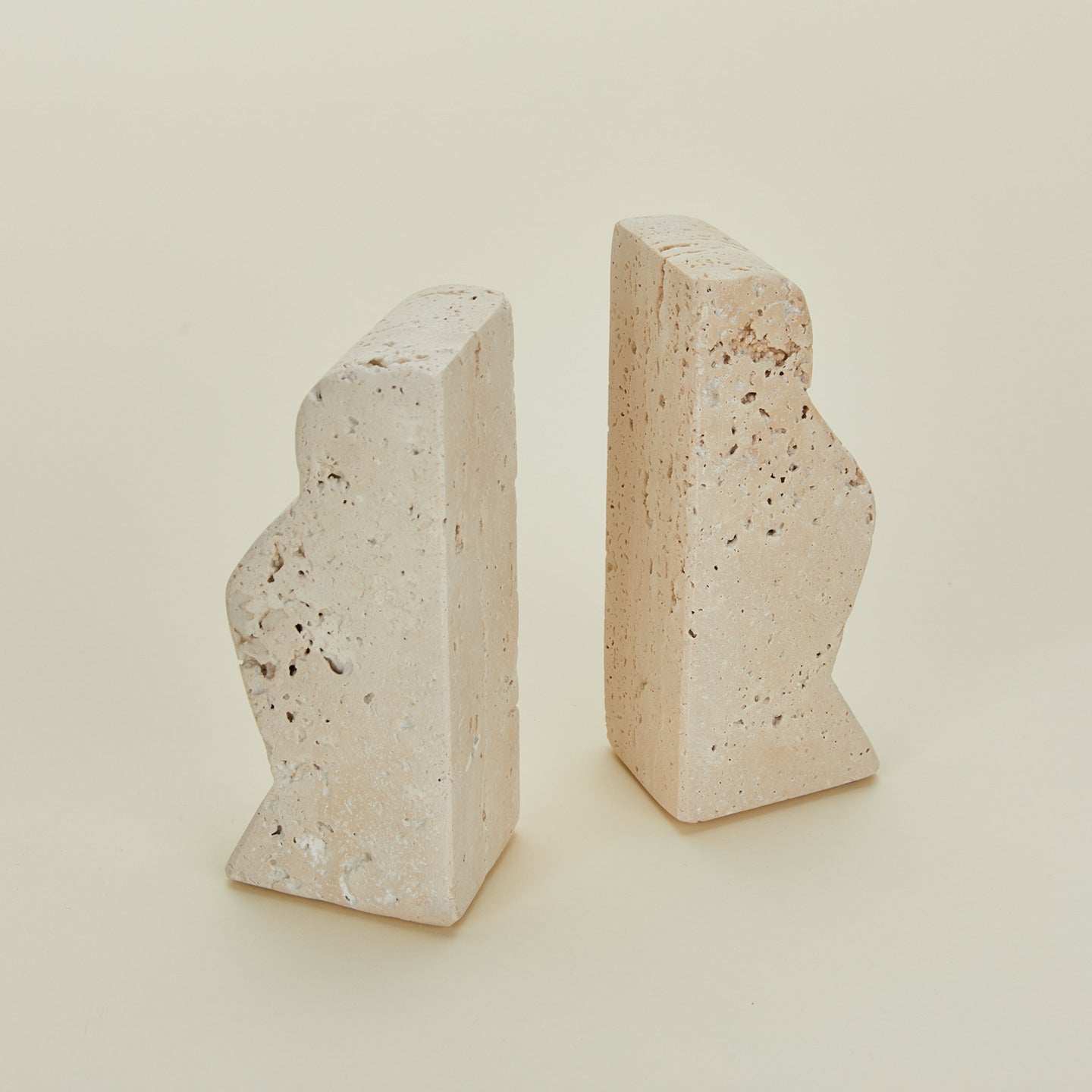 Detailed view of Bloomingville travertine wave bookends